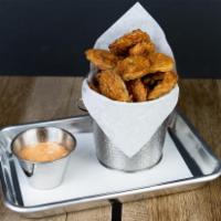 Fried Pickles · Hand breaded pickles fried in wagyu tallow.