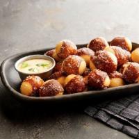 Pretzel Bites · Served with cheddar cheese sauce and mustard
