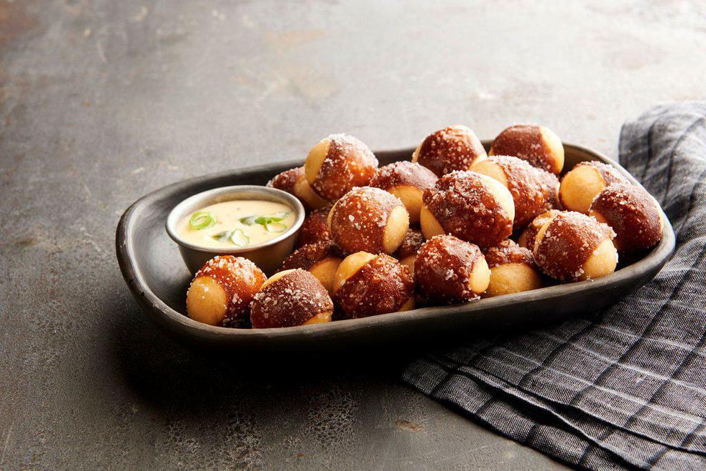 Pretzel Bites · Served with cheddar cheese sauce and mustard