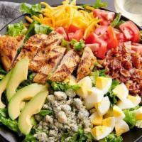 Chopped Cobb Salad · Grilled chicken, crispy bacon, avocado, diced egg and tomatoes with bleu cheese crumbles and...