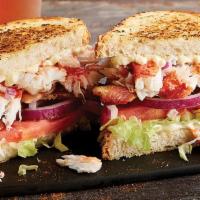 Lobster BLT · Lobster claw meat, smoked bacon, sliced tomatoes, shredded lettuce and mayo on grilled Parme...