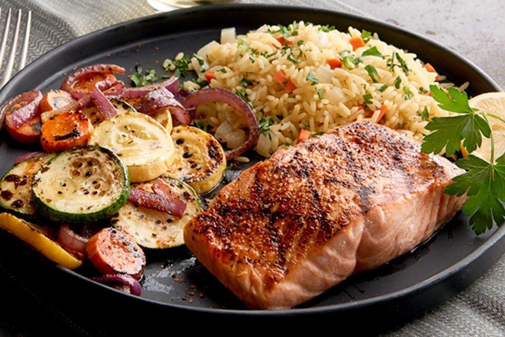 Atlantic Salmon (GS) · Gluten sensitive. Flame grilled, choice of garlic herb butter, blackened or BBQ Glazed. Served with choice of 2 sides. 