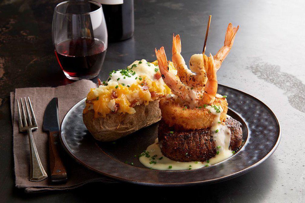 Steak ＆ Shrimp · 7 oz Certified Angus Beef Top Sirloin served with grilled shrimp, a Parmesan onion ring and lemon butter. Served with choice of 2 sides. 
