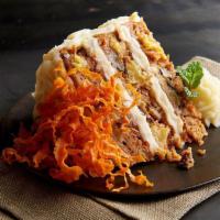 Carrot Cake · Three layers of subtly spiced carrot cake, generously covered with cream cheese frosting.