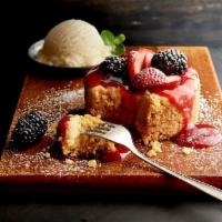 Berry Butter Cake · Served with vanilla ice cream, strawberry sauce and fresh berries