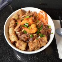 57. Bun Dac Biet · Combo‎ noodle bowl with shrimp, pork, chicken, and egg roll.