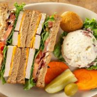 Club Sandwich · Oven-roasted turkey breast, bacon, cheddar cheese, lettuce, tomato, and mayonnaise.