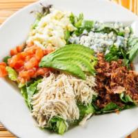 Cobb Salad · Chicken, bacon, bleu cheese crumbles, eggs, tomatoes, and avocado on top of mixed greens. Ch...