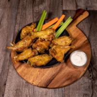Chicken Wings · Served with carrots and celery with choice of sauce.