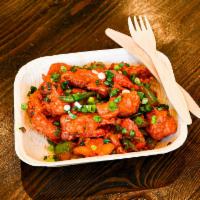 Chicken 65 · Spicy crispy chicken tossed with bell peppers, garlic and chili sauce.