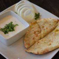 Aloo Paratha · Flatbread stuffed with a blend of Potatoes, Cilantro, and Indian spices cooked in Tandoor ov...