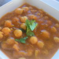 Chole Masala · Garbanzo beans cooked with onions, potatoes, tomatoes and spices. Gluten Free. 