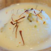 Rasmalai (2 pcs) · Soft cheese balls soaked in flavored delicate milk sauce, topped with nuts.
