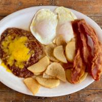 2 Eggs Breakfast · Served with bacon, potatoes, and double refried beans.