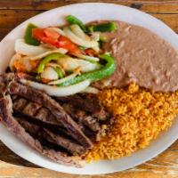1. Rice and Beans Fajita · Meat, sauteed onions, peppers, and 3 tortillas.