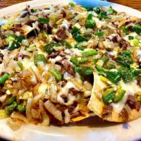Edu's Spicy Brisket Nachos · Brisket, grilled onions and jalapenos and jack cheese.