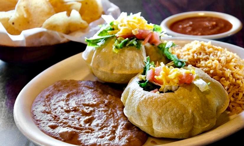 Puffed Taco Dinner · Two puffy tacos, rice and beans.