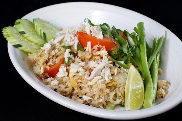 Fried Rice  · Fried rice with eggs, tomatoes, green onion, yellow onion, cilantro