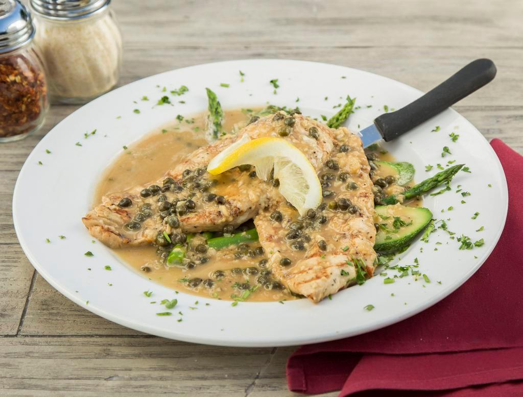 Chicken Picatta · Grilled chicken in a caper, lemon, butter, white wine and garlic sauce. Well balanced and fresh. Served with seasonal vegetables.