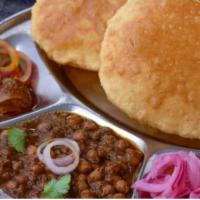 Chole Bhatura  · Chickpeas served with bhatura bread 