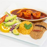 Camarones a la Diabla · Shrimp with red hot sauce, homemade chorizo and beans mix and rice.