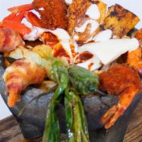 Molcajete de Mriscos · Grilled shrimp, breaded shrimp, a la diabla shrimp, octopus, filet of fish and nopal.