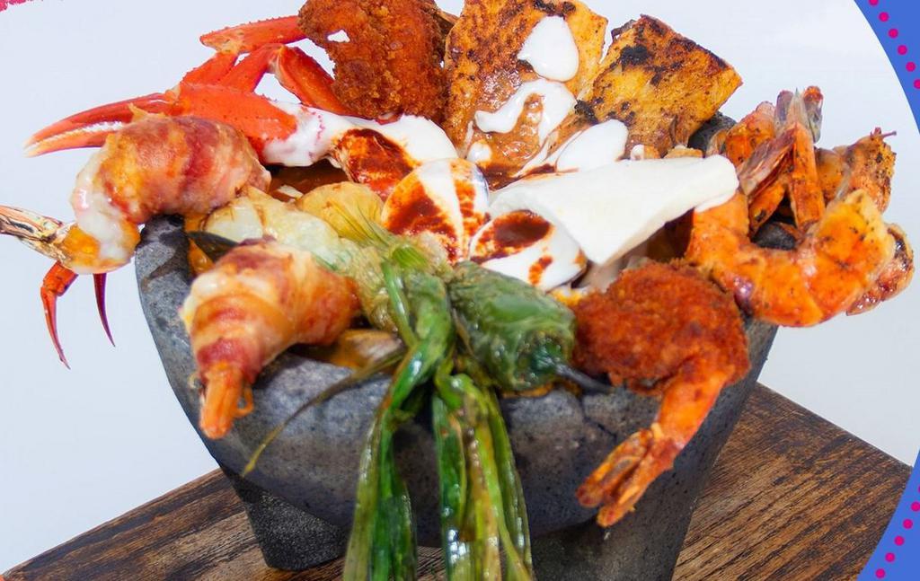 Molcajete de Mriscos · Grilled shrimp, breaded shrimp, a la diabla shrimp, octopus, filet of fish and nopal.