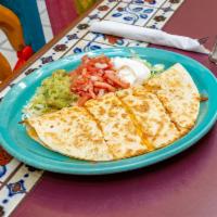 Quesadilla · Large flour tortilla filled with Jack and cheddar cheese, choice of chicken, ground beef, or...