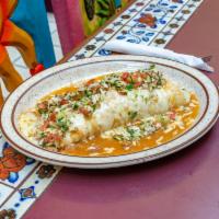 Burrito al Pastor · Flour tortilla filled with chopped grilled marinated pork loin, rice, whole beans smothered ...
