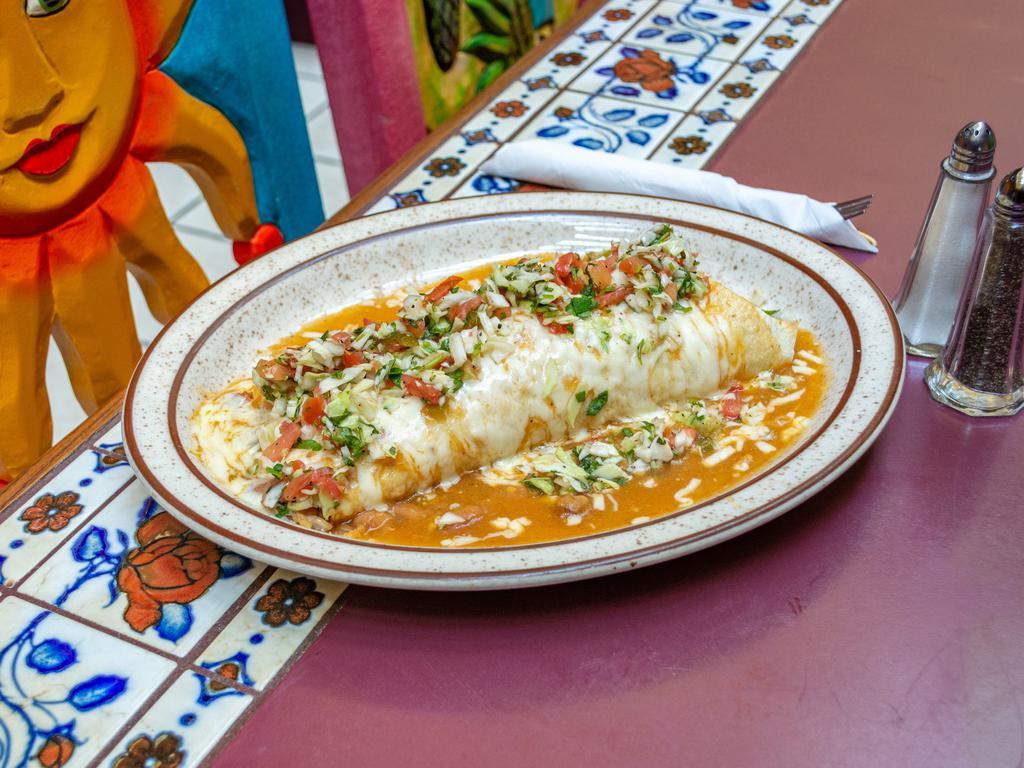 Burrito al Pastor · Flour tortilla filled with chopped grilled marinated pork loin, rice, whole beans smothered with our special pork green chile topped with Monterrey Jack cheese and sprinkled with pico de gallo.