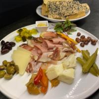 Charcuterie Platter · hand crafted meats + cheeses + pickles + olives + flatbread