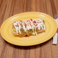 Macho · Choice of beans, rice, cheese, topped with sauce, guacamole, sour cream, tomatoes, Parmesan ...