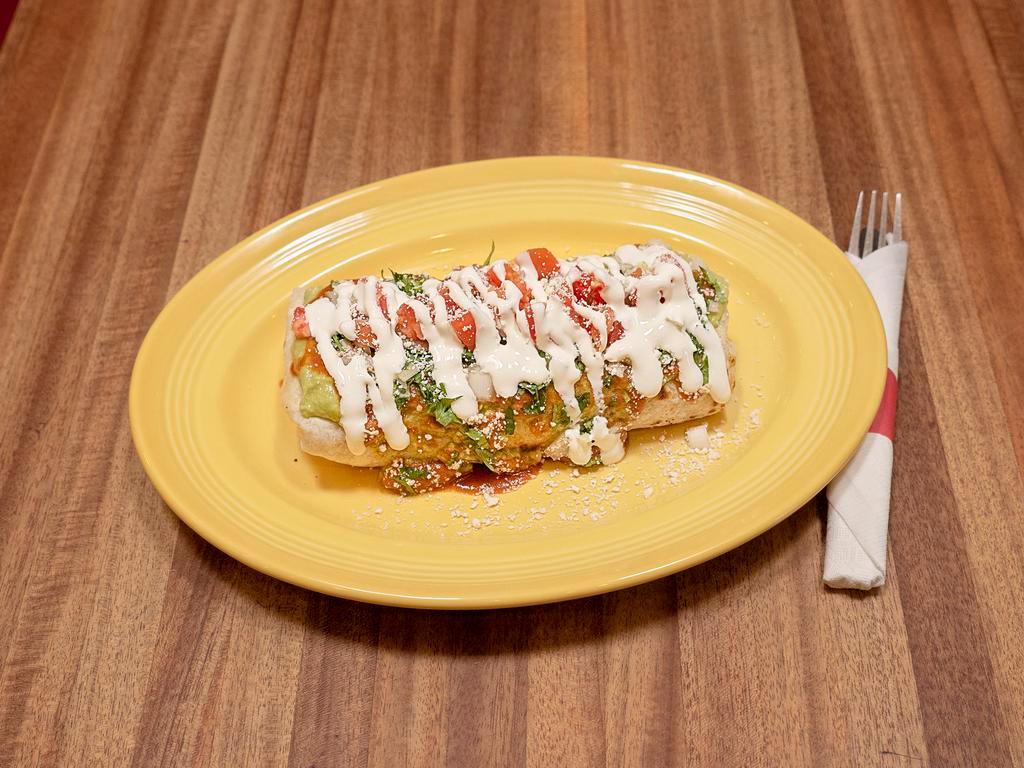 Macho · Choice of beans, rice, cheese, topped with sauce, guacamole, sour cream, tomatoes, Parmesan cheese, onion and cilantro.