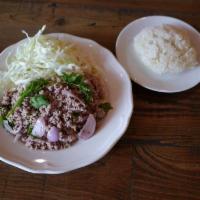 Larb with Sticky Rice Salad · Northeastern Thai salad seasoned with lime juice, onions, scallions, mint, and ground rice; ...