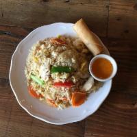 Thai Fried Rice · Thai stir fried rice with onion, green onion, carrots, eggs and tomatoes.