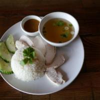 Khao Man Gal · Chicken poached in a broth served with garlic ginger infused rice. Chicken and rice.