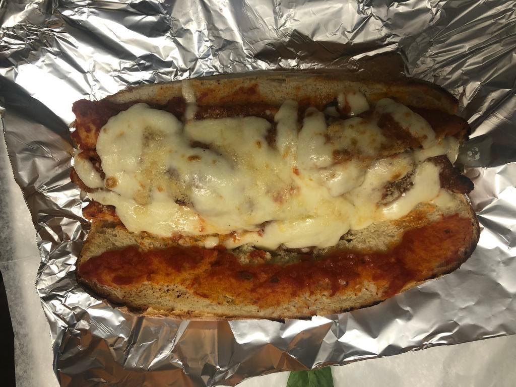 Chicken Parm Hero · Chicken Cutlet ,Tomato Sauce,Mozzarella and Parmesan Cheese 