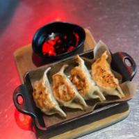 Gyoza. · Pork, cabbage, garlic, ginger, Chinese chive. Recommended.