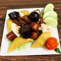 Small Picada Colombiana Platter · Grilled steak, grilled chicken, Colombian sausage, pork skin, blood sausage, green plantain ...