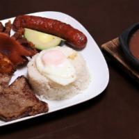 Typical Colombian Dish Plate · Rice and beans, grilled steak, pork loin, fried egg  and sweet plantains.
