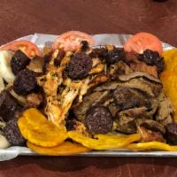 Picada Colombiana Plate · Grilled steak, grilled chicken, Colombian sausage, pork skin, blood sausage, green plantain ...
