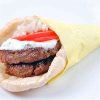 Beefteki · A spiced ground beef patty grilled and made like a yeero with onions, tomatoes and choice of...
