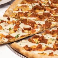 Buffalo Chicken Pizza · Breaded chicken cutlet smothered in buffalo wing sauce and mozzarella.