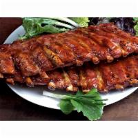 Maciano's Famous Baby Back Ribs · A full rack of our delicious ribs, baked in our own secret barbecue sauce. Served with Frenc...