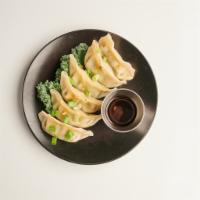 Steamed Veggie Gyoza (6 pcs) · Steamed the combination of Spinach, carrots, Cabbage, Corn and Water Chestnut served with Ga...
