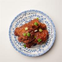Tamarind Wings (5pcs) · Fried chicken wings glazed with tamarind sauce. Spicy.
