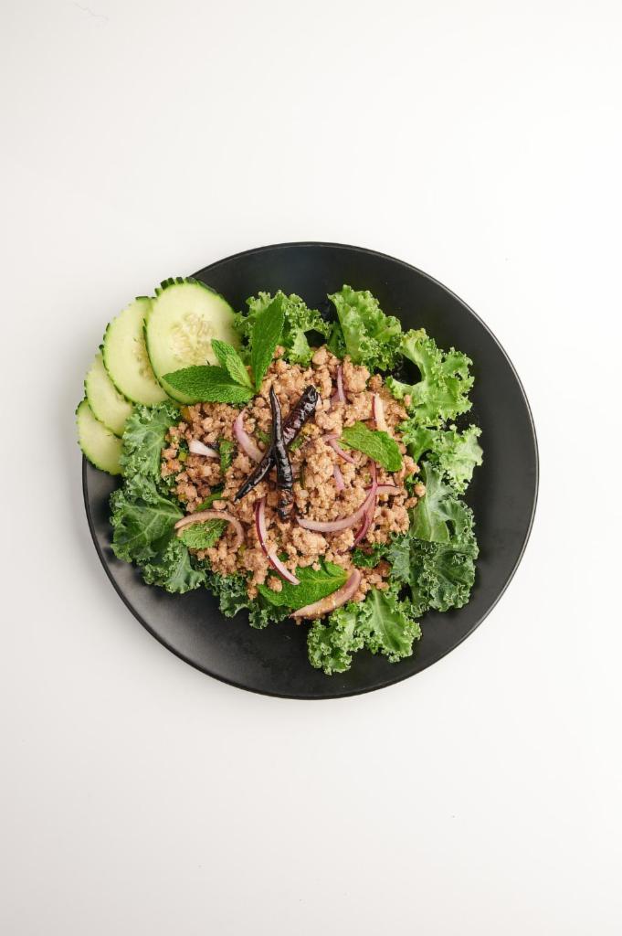 Lucky Piggy · Larb. Spicy and sour ground pork salad mixed with Thai herbs, mint, scallion, red onion. Gluten-free, spicy.