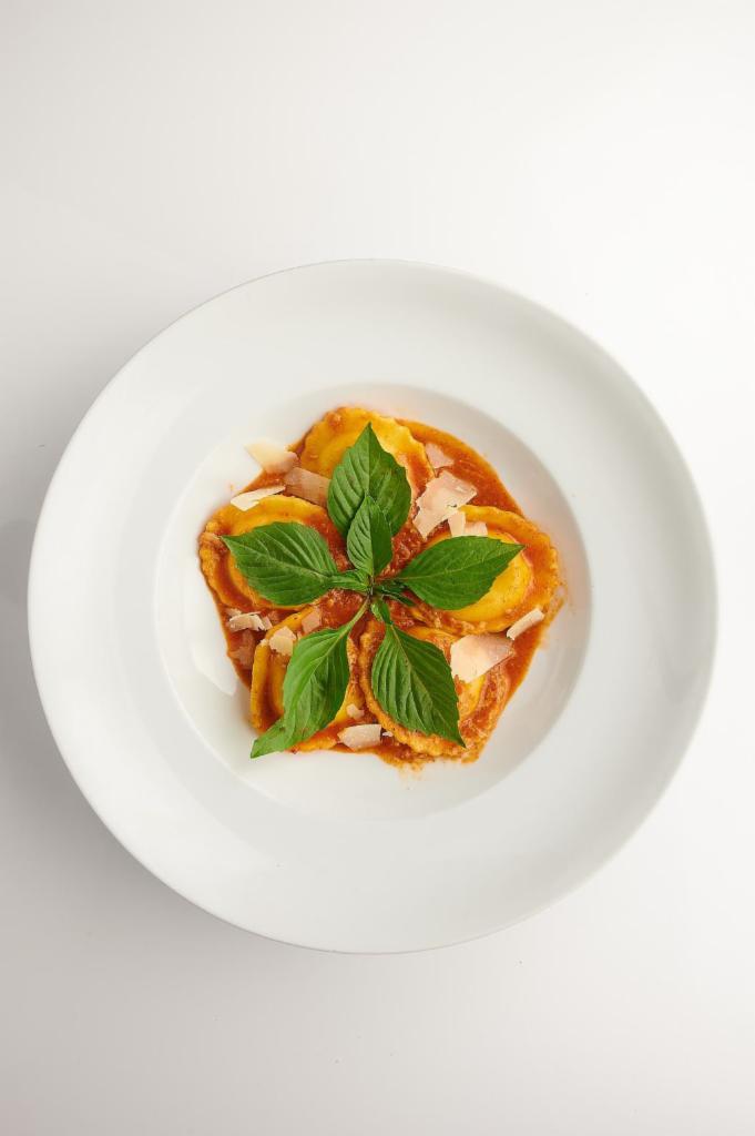 Ravioli Tom Yum · Basil not avialable Cheesy ravioli in Thai homemade tom yum paste mixed with Parmesan topped with fresh basil. Spicy.
