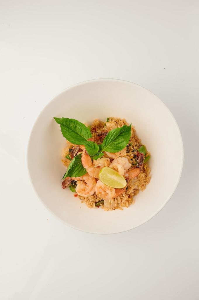 Basil Fried Rice · Stir-fried rice with basil,  egg, chili, garlic, string bean, bell pepper, and onion. It is Spicy.