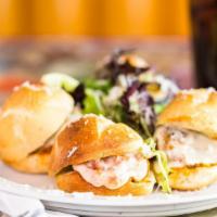 Sausage Sliders · Four Polidori Italian sausage links on mini subs with peppers and onions and topped with mar...